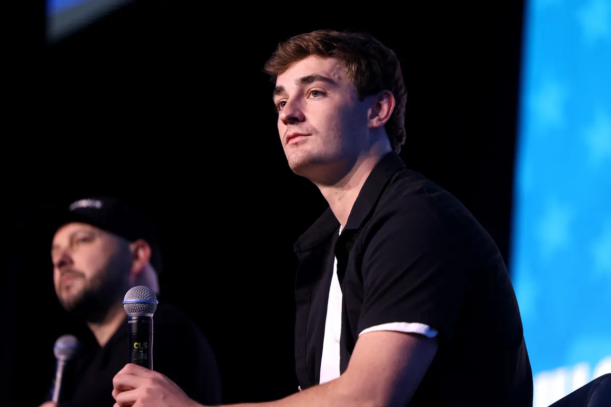 Nick Shirley speaking on stage at a 2026 event